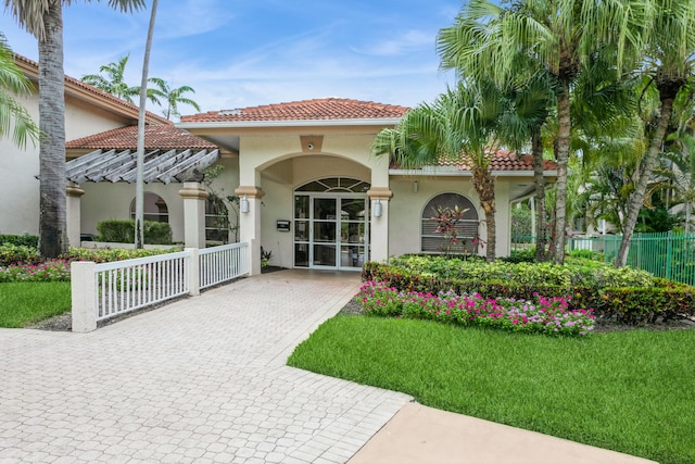 rear view of property featuring french doors