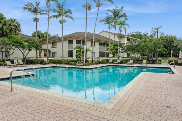 view of swimming pool with a patio area