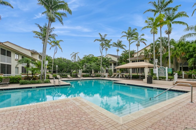 view of swimming pool with a gazebo and a patio