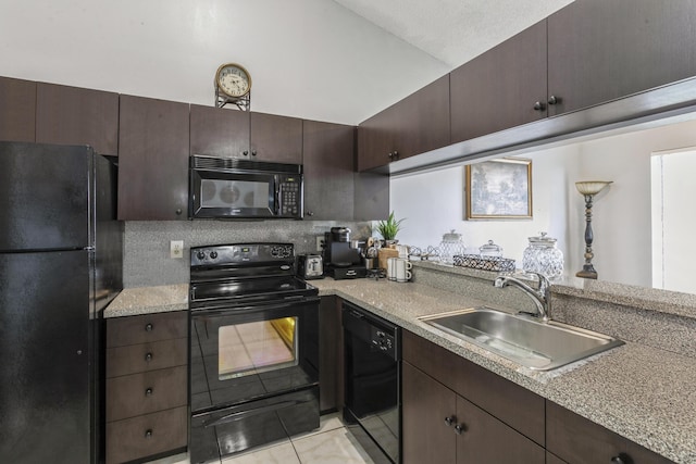 kitchen with sink, light tile patterned floors, black appliances, and dark brown cabinets