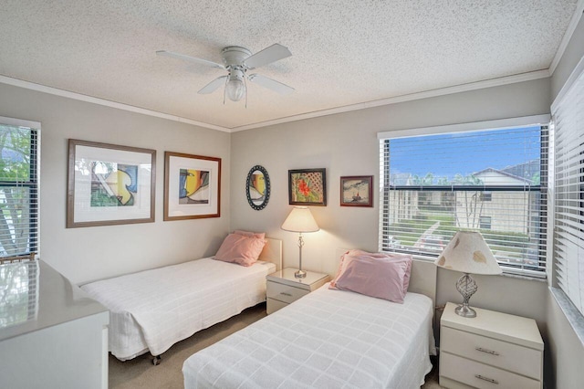 carpeted bedroom featuring multiple windows, ornamental molding, and a textured ceiling