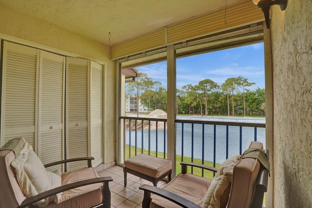 sunroom with a water view