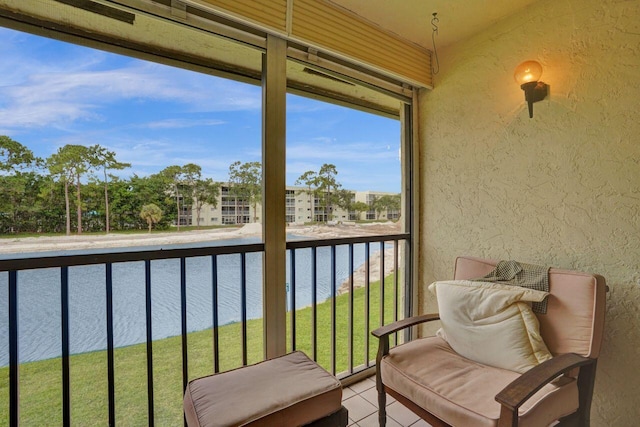 balcony featuring a water view