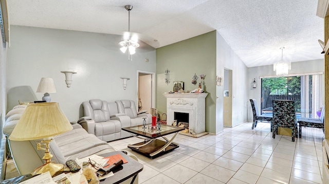 living room featuring ceiling fan with notable chandelier, light tile patterned floors, a textured ceiling, and vaulted ceiling