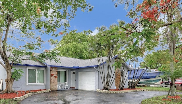 ranch-style home with a garage