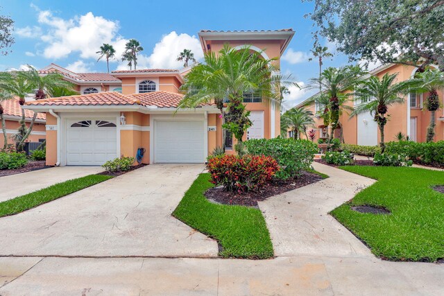 mediterranean / spanish house with a garage