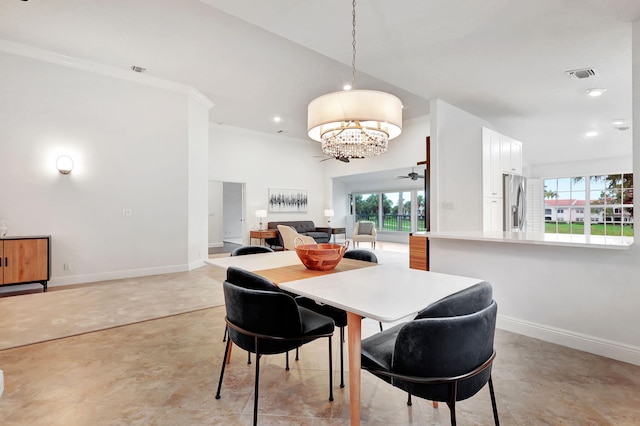 dining area featuring crown molding and a notable chandelier