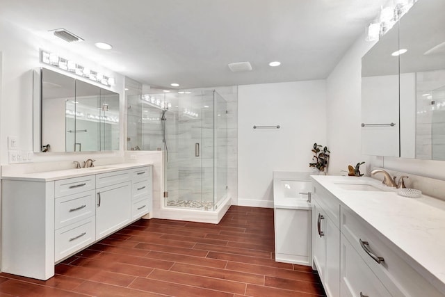 bathroom with vanity and an enclosed shower