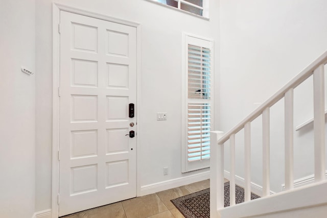 foyer featuring light tile patterned floors