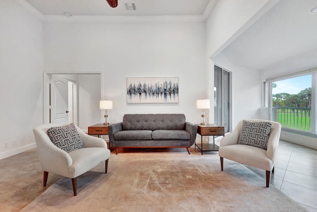 tiled living room with ornamental molding