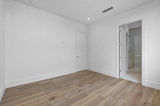 unfurnished room featuring light wood-type flooring