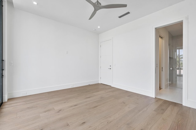 empty room featuring ceiling fan and light hardwood / wood-style floors