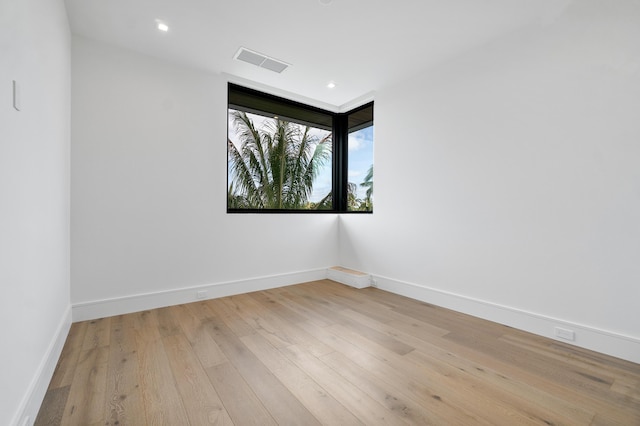 unfurnished room with light wood-type flooring