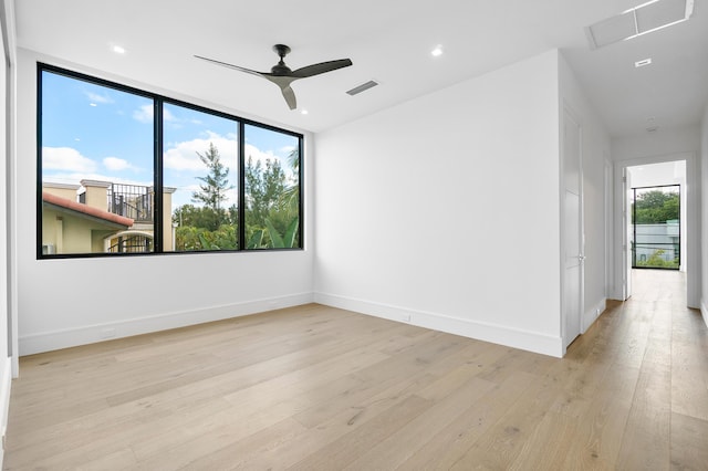 empty room featuring light hardwood / wood-style flooring and ceiling fan