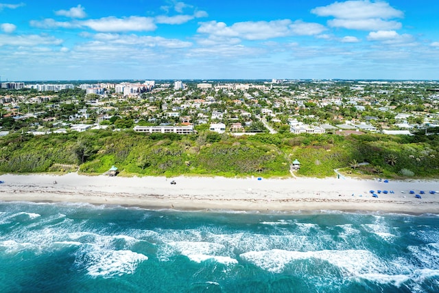 aerial view with a water view and a view of the beach