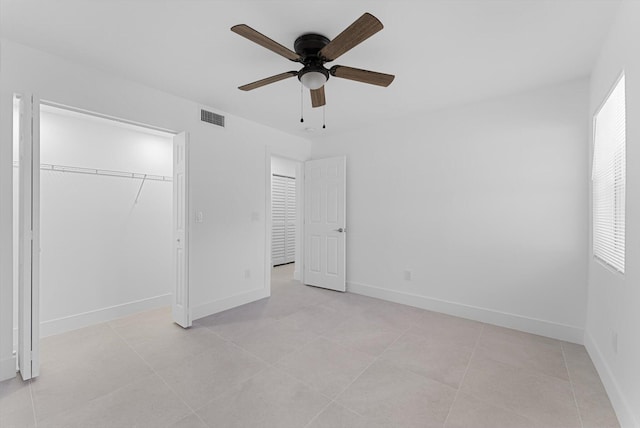 unfurnished bedroom featuring a closet, ceiling fan, and light tile patterned flooring