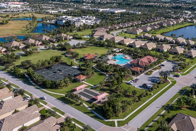 drone / aerial view with a residential view and a water view