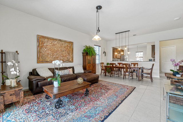 living room with light tile patterned floors and baseboards