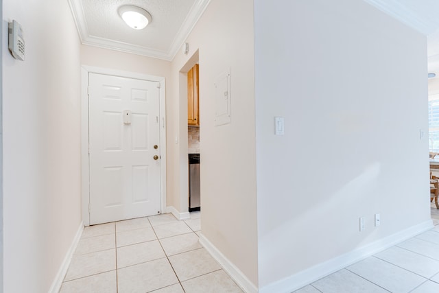 corridor featuring crown molding, light tile patterned floors, and a textured ceiling