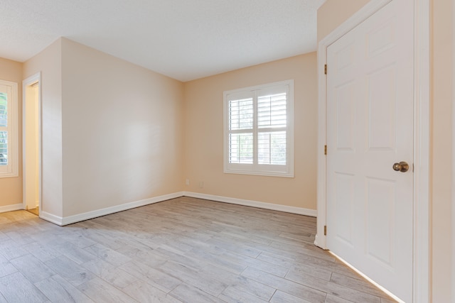 unfurnished room featuring light hardwood / wood-style flooring