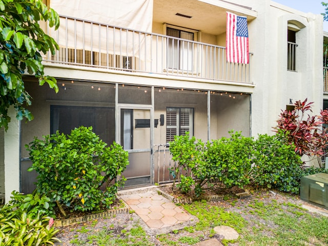 doorway to property with a balcony