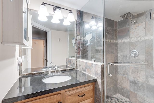 bathroom with vanity and an enclosed shower