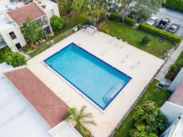 view of swimming pool featuring a patio area