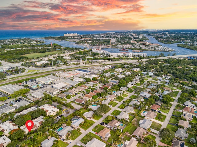 aerial view at dusk with a water view