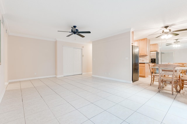 empty room with ceiling fan, light tile patterned flooring, and crown molding