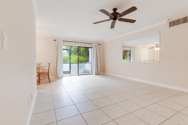 tiled empty room with a textured ceiling, ceiling fan, and ornamental molding