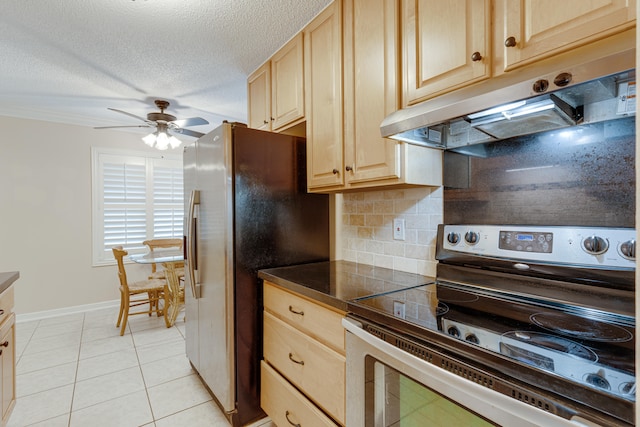 kitchen featuring ceiling fan, stainless steel appliances, decorative backsplash, light brown cabinetry, and light tile patterned floors