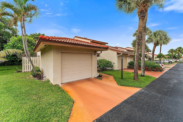 view of front facade with a front yard and a garage