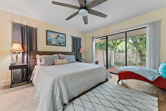 bedroom with light wood-type flooring, ceiling fan, and access to exterior