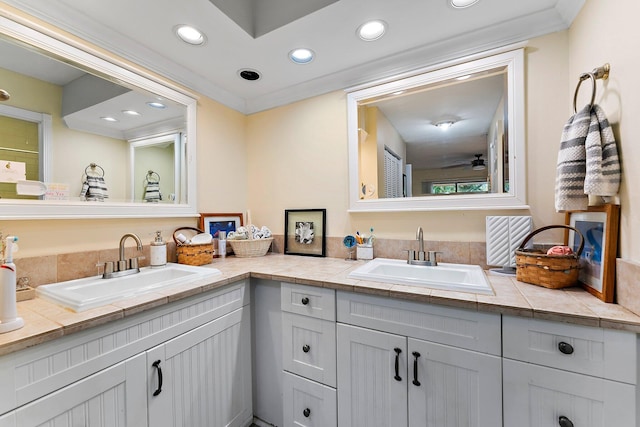 bathroom with ceiling fan and vanity