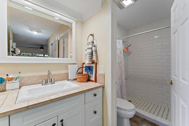 bathroom featuring ceiling fan, a shower with curtain, vanity, and toilet