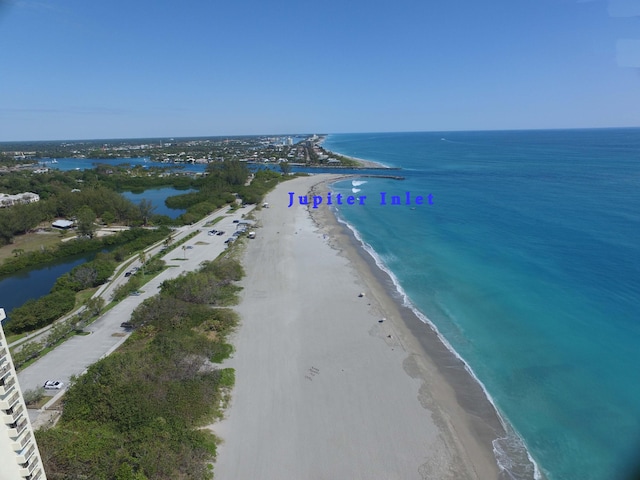 bird's eye view with a view of the beach and a water view