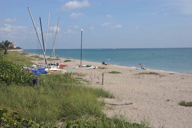 view of water feature with a beach view