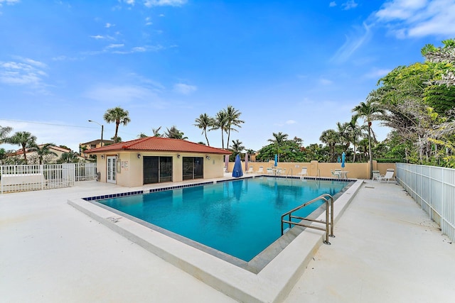 view of pool featuring a patio