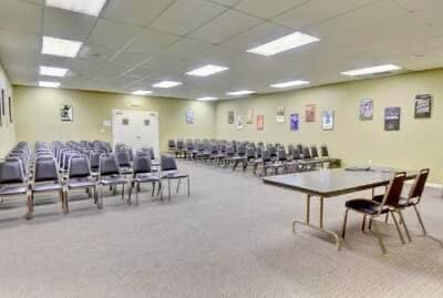 interior space with carpet and a paneled ceiling