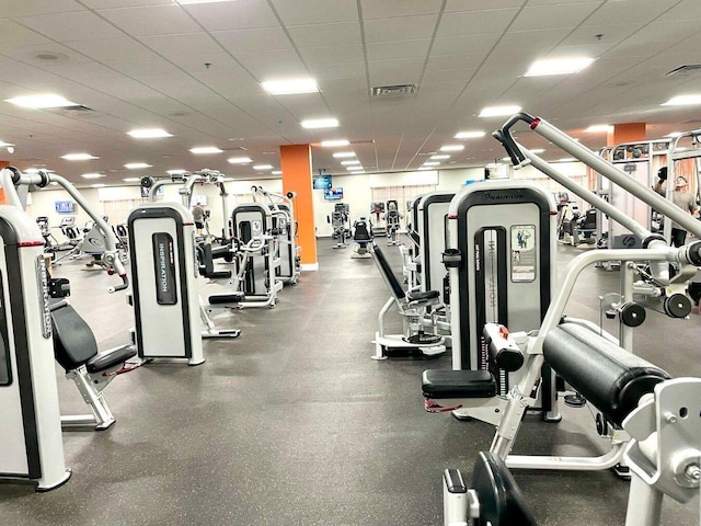 workout area featuring a paneled ceiling