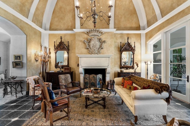 living area with arched walkways, stone tile floors, a chandelier, and a fireplace