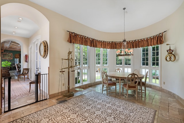 dining area featuring a chandelier and tile floors