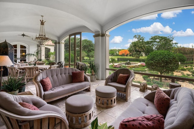 sunroom / solarium with lofted ceiling and french doors