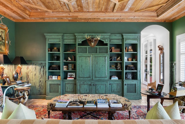 living room with light tile flooring and wood ceiling