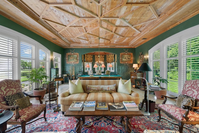 sunroom featuring wooden ceiling, coffered ceiling, and an inviting chandelier