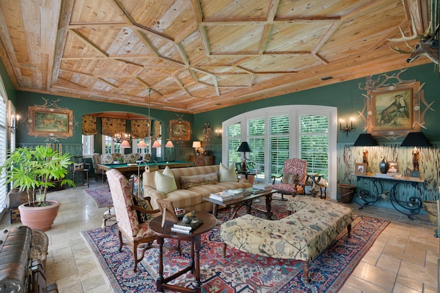 tiled living room featuring a notable chandelier, vaulted ceiling, and wood ceiling