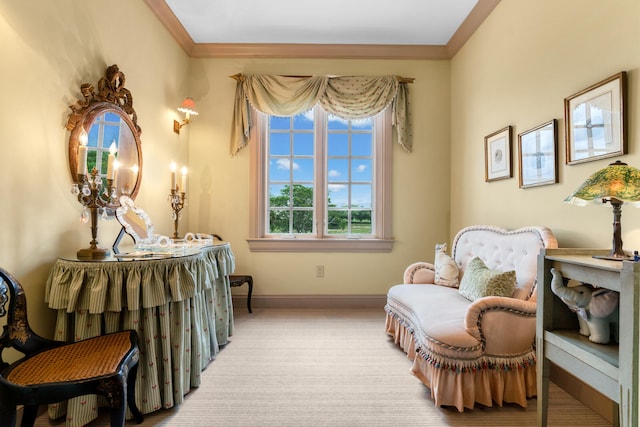 sitting room with carpet and ornamental molding