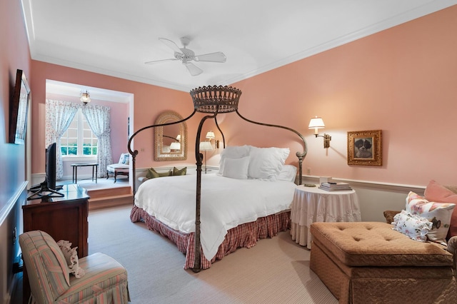 bedroom featuring ceiling fan, carpet floors, and ornamental molding