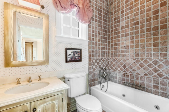 full bath featuring wallpapered walls, toilet, vanity, and shower / bathtub combination