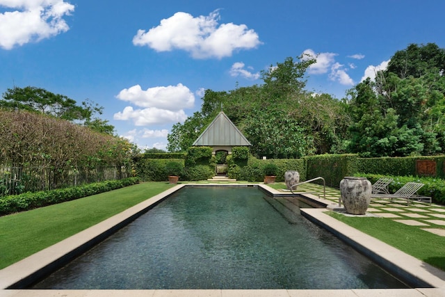 view of swimming pool with fence